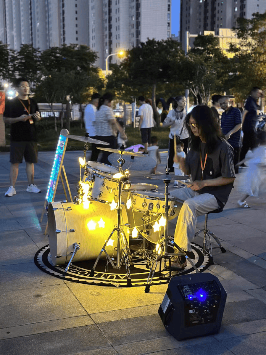 KeithHernailvt's tweet photo. [A street performer shakes a drum while a flagpole shakes in the breeze—vibes of fun on the go!]， https://t.co/cqyUgPIdhy