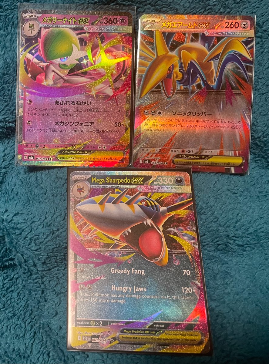 yubicopter's tweet photo. also some mega ex cards i bought around the same time.. tbh the jp ones look a little shinier but sharpedo’s my baby so it’s fine qwq https://t.co/23FJSlUCF6