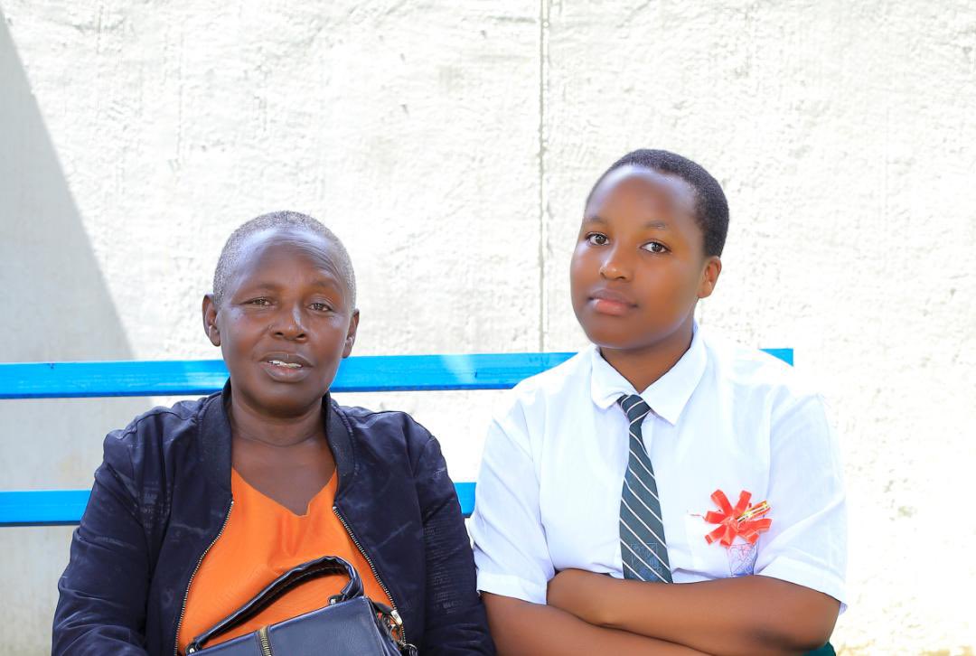 AdamNuwamanya's tweet photo. MY FIRST TEACHER — MY MOTHER

This Teachers’ Week, I choose to celebrate my first teacher: my mother, Ms. Kiconco (gift) Edray Muramiira — a strong lover of education, which life’s upheavals unfortunately denied her.

Dr. @MuramuziDr, she is your sister. You know this musiingo lady whose totem are the red ants (ensanafu, empazi).

In the early 1990s, as a young mother, she could not afford school fees for our primary education. But she refused to let financial incapacitation become an excuse for our education.

She walked to nearby primary schools, borrowed English and Arithmetic textbooks, and taught us sounds (calling things as sings, you can imagine), counting, simple addition and subtraction, sometimes using obuceence, obushekye, obukyokori bwa soda, as our learning aids.

Her fellow women in Rwenkuba Village envied her.

“Mbwenu eseente zabuzire, kambeshomeseze.”

A total gold sealed in rags.

I still remember one lesson she repeatedly taught me:

“Adam, never underestimate anything. Small things matter.”

I kept those words. And indeed, as I look back now, I realise that the small things have mattered  enormously.

She named me Nuwamanya — “God is the one who knows.” Even today, whenever you ask her about something that appears impossible to us but remains possible in the eyes of God, she gives you the same answer: God knows.

The picture captures her with our last-born, my sister Polline, born in 2007 — now a scientist of BCM, a combination different from the others in the family. Mine was HEL/K, another sibling took DEG/A, while two others did not reach that far in their education.

But perhaps that is the point of her story: education is not merely about the combinations we studied; it is about the possibilities a teacher opens in a child’s life.

My mother may never have had the opportunity to receive the education she desired, but she became a teacher anyway.

And before I knew what a classroom was, she was my classroom.

Happy #TeachersDay2026 to my first teacher, my mother. ❤️
