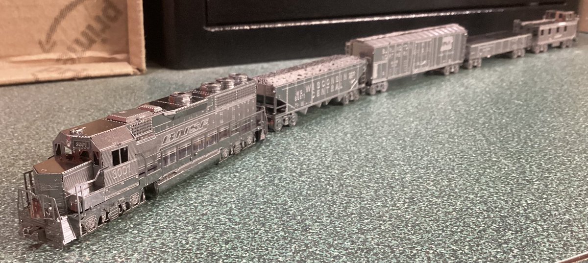 CK124theTSE's tweet photo. Metal Earth Freight Train Steel Model Kit Gift Set 

- BNSF EMD GP40 Diesel Locomotive
- Wisconsin Central Hopper
- Burlington Northern Boxcar
- Canadian/Canadien National Gondola (“do anything” car)
- BNSF Caboose https://t.co/gxjCuW8SvB
