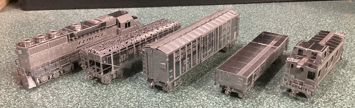 CK124theTSE's tweet photo. Metal Earth Freight Train Steel Model Kit Gift Set 

- BNSF EMD GP40 Diesel Locomotive
- Wisconsin Central Hopper
- Burlington Northern Boxcar
- Canadian/Canadien National Gondola (“do anything” car)
- BNSF Caboose https://t.co/gxjCuW8SvB