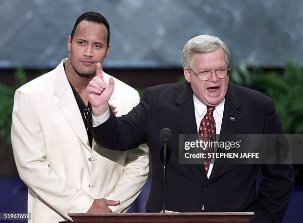 EricMGarcia's tweet photo. Throwback to when The Rock stood next Dennis Hastert at the 2000 Republican National Convention. https://t.co/2A6hgrrxlI