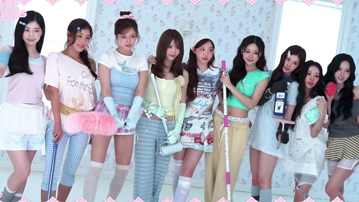 Nine female K-pop idols stand in a row wearing various colorful, pastel, and stylish outfits in a promotional photo for the song 'Supersonic' by fromis_9.