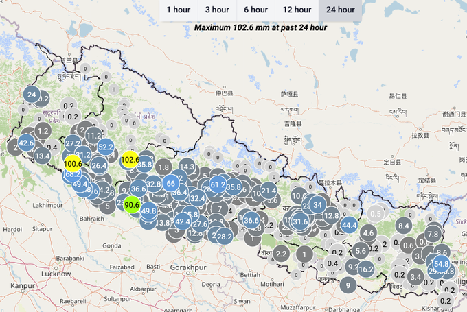 A weather map showing rainfall data across a region with cities like Lucknow, Gorakhpur, and Bahraich labeled, with maximum rainfall of 102.6 mm noted.