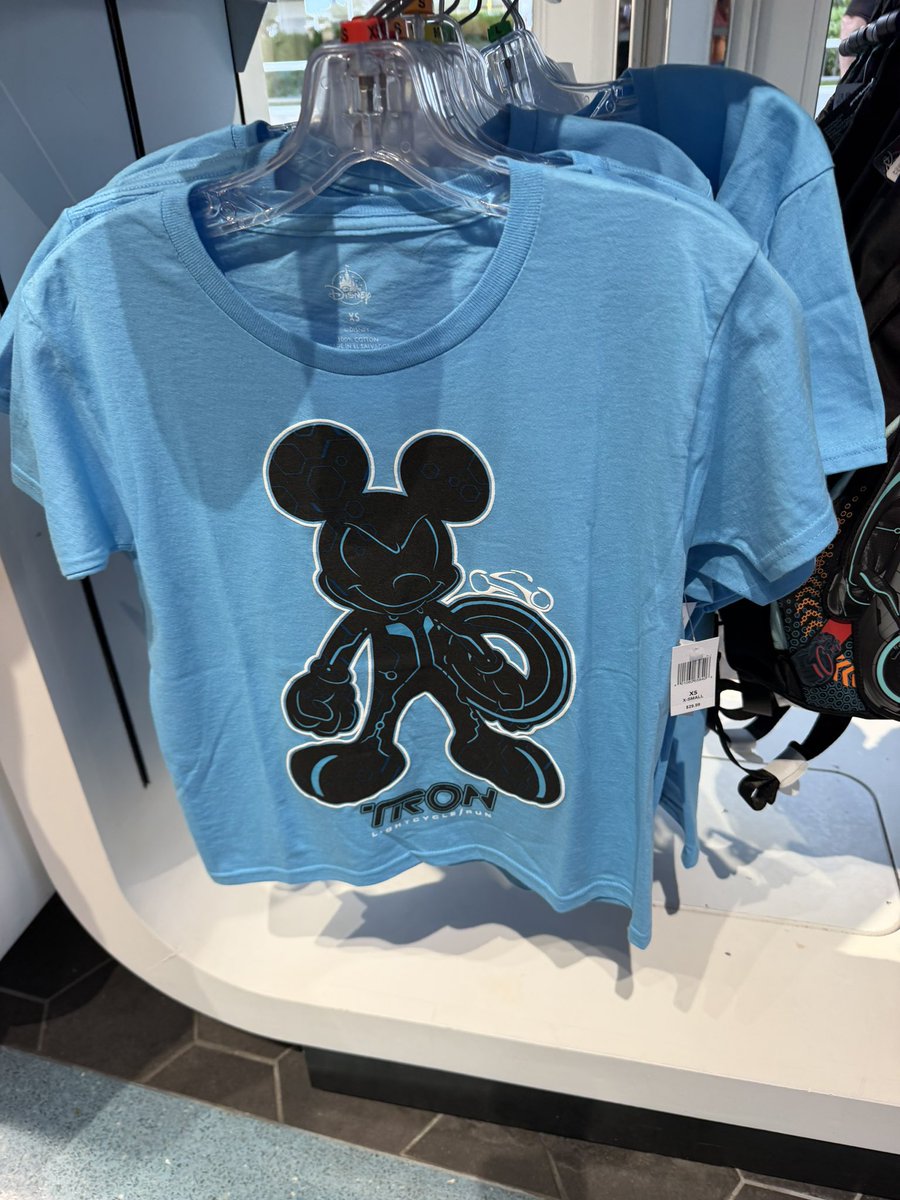 DigitizedUser's tweet photo. Ladies and gentleman, it is 2026 and there is a new wave of TRON merch at Disney World’s Magic Kingdom! (1/2)

(📸 @CoasterK24) https://t.co/9IhI2KaJzA