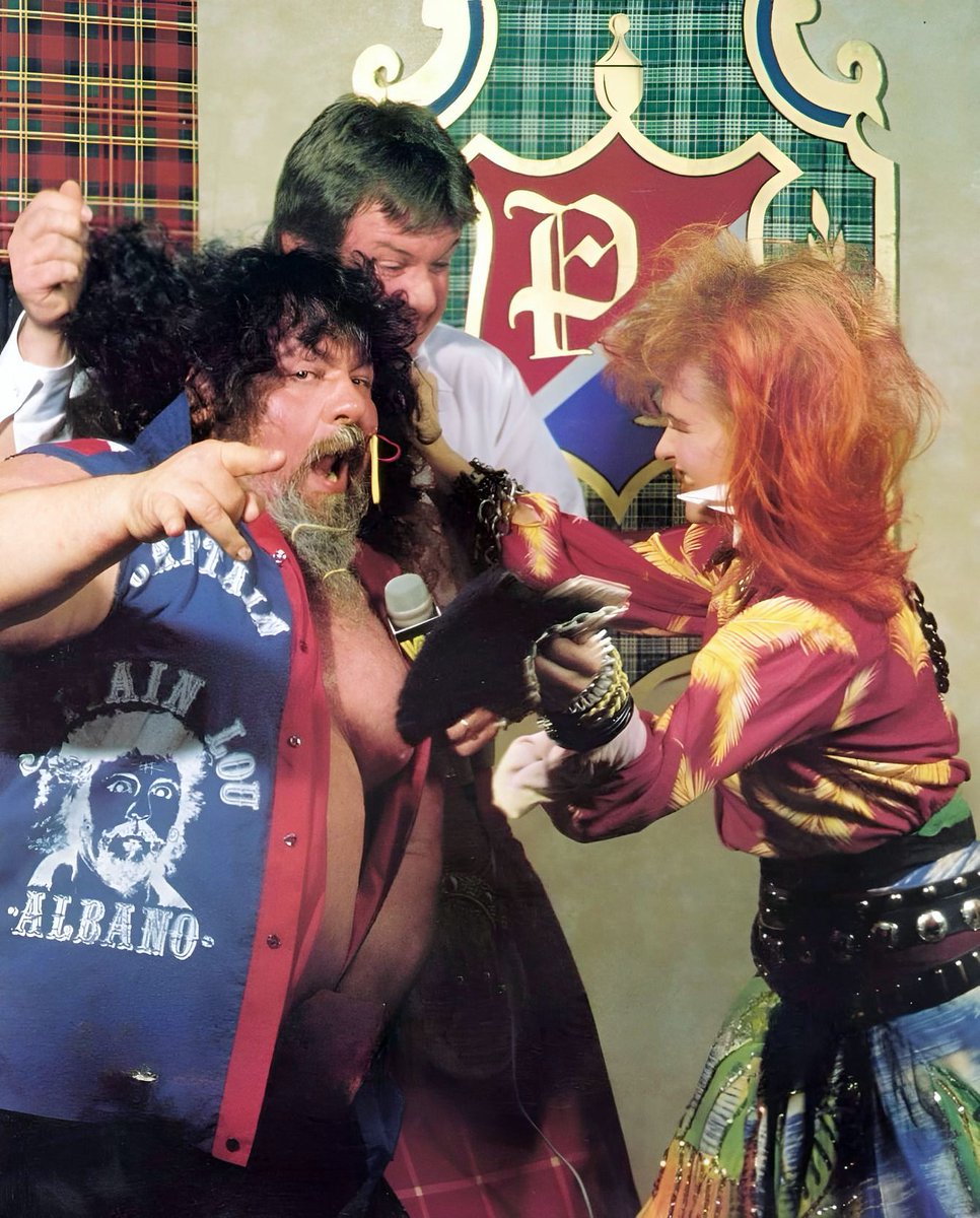 WWFWrestling1's tweet photo. ๐ฅ Federation Flashback! The June 16, 1984 edition of Championship Wrestling saw Cyndi Lauper guesting on Piperโs Pit. Following insults from Lou Albano, Lauper attacked the Captain & Hot Rod and the "Rock 'n' Wrestling" era was born. #WWF #WWE #RoddyPiper #LouAlbano #CyndiLauper https://t.co/x81uIgRxbr