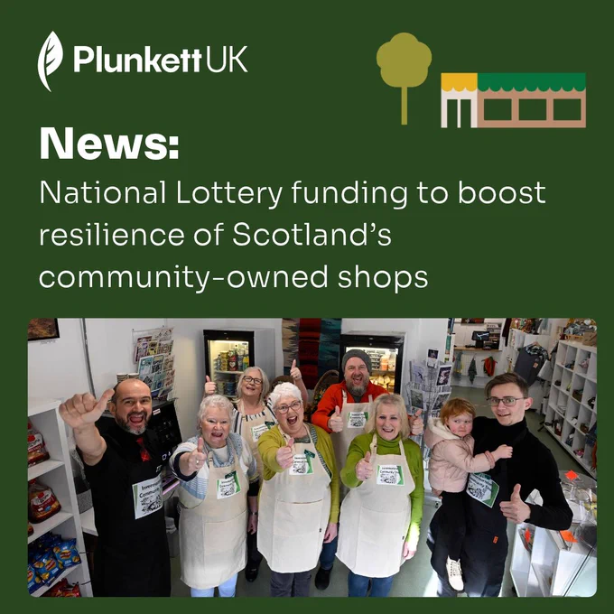 Plunkett UK graphic announcing National Lottery funding for Scotland’s community-owned shops. The headline reads: “News: National Lottery funding to boost resilience of Scotland’s community-owned shops.” Beneath the text, a photograph shows eight people inside a community-owned shop wearing aprons and giving thumbs up. Shelves, products and display units are visible around the shop interior. The Plunkett UK logo appears at the top of the graphic.