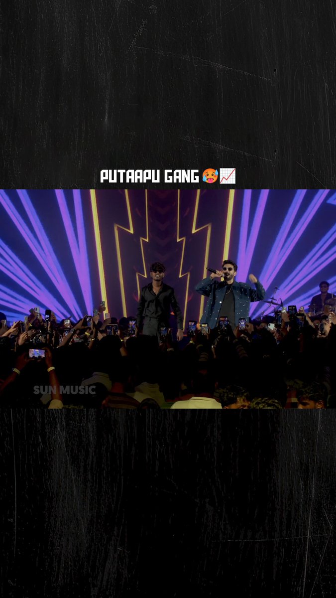 A concert scene with text "PUTAAPU GANG" overlaid, showing two performers on stage with a crowd in front and "SUN MUSIC" watermark visible.