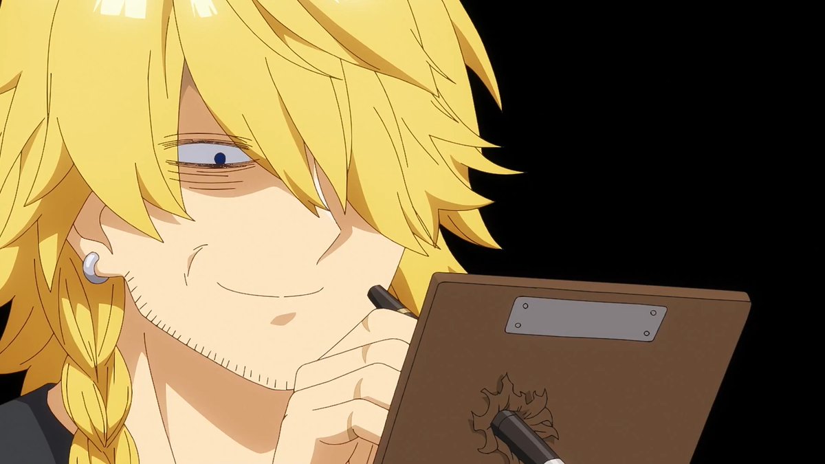 A blonde anime character with a braid and small smile writes in a brown book bearing a flame emblem, suggesting a scene of scheming that contrasts with the cheerful fantasy comedy tone of *Sudachi no Maoujou* (The Fledgling Demon Lord's Starter Shop) news.