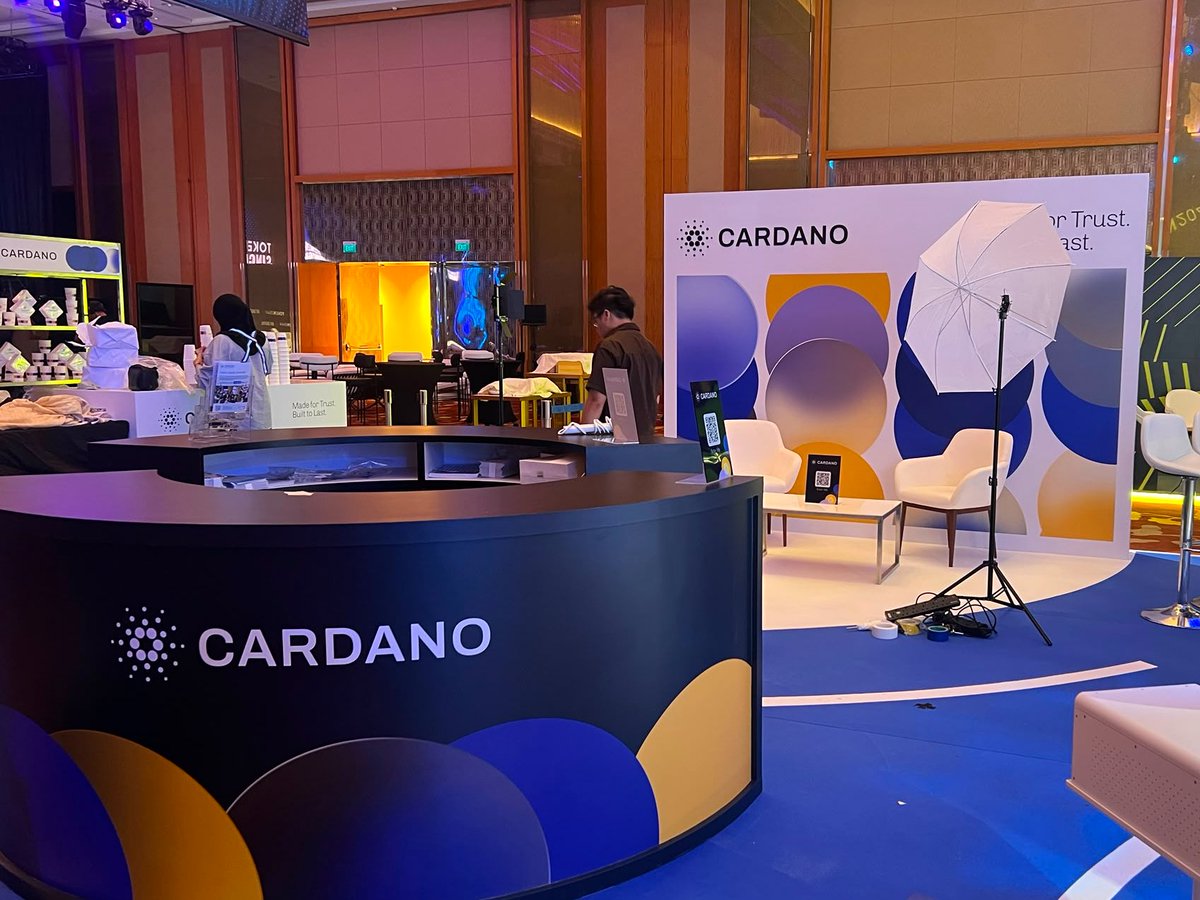 Cardano_CF's tweet photo. Cardano booth at @TOKEN2049 is up. PB5-60.

Here's what to expect:
A stage with 30+ ecosystem speakers.
A podcast studio, recording on site.
A scannable ecosystem wall.
The CF team, both days.
Merch, while it lasts.
Free coffee too.

Swing by, say hi. See you tomorrow. https://t.co/p9g5iNaeL0