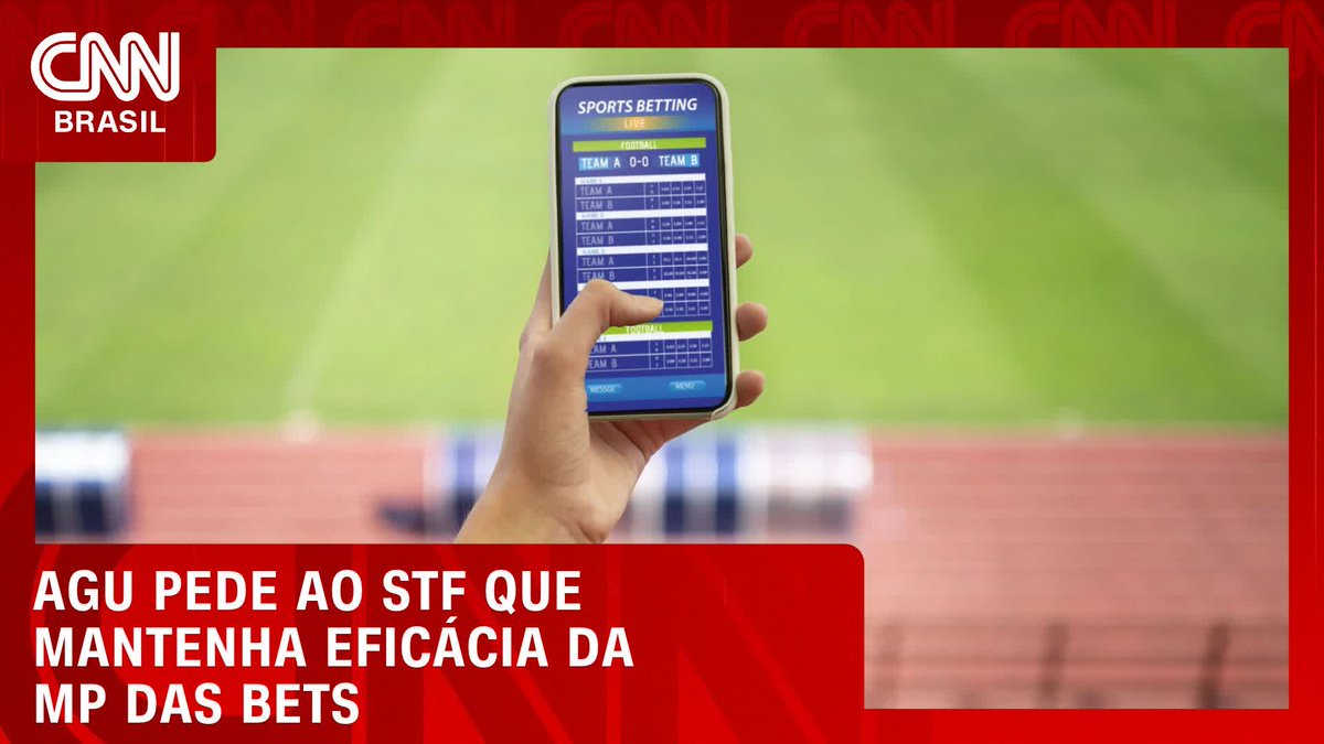 A hand holds a smartphone displaying a "Sports Betting Live" football betting app with "Team A" vs "Team B" odds, set against a blurred stadium background, illustrating the news headline "AGU pede ao STF que mantenha eficácia da MP das bets." The image visually represents the topic of sports betting regulation in Brazil, aligning with the post about the Attorney General's request to the Supreme Federal Court (STF) to maintain the effectiveness of the Provisional Measure on bets.