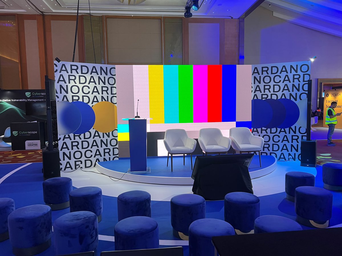 Cardano_CF's tweet photo. Cardano booth at @TOKEN2049 is up. PB5-60.

Here's what to expect:
A stage with 30+ ecosystem speakers.
A podcast studio, recording on site.
A scannable ecosystem wall.
The CF team, both days.
Merch, while it lasts.
Free coffee too.

Swing by, say hi. See you tomorrow. https://t.co/p9g5iNaeL0