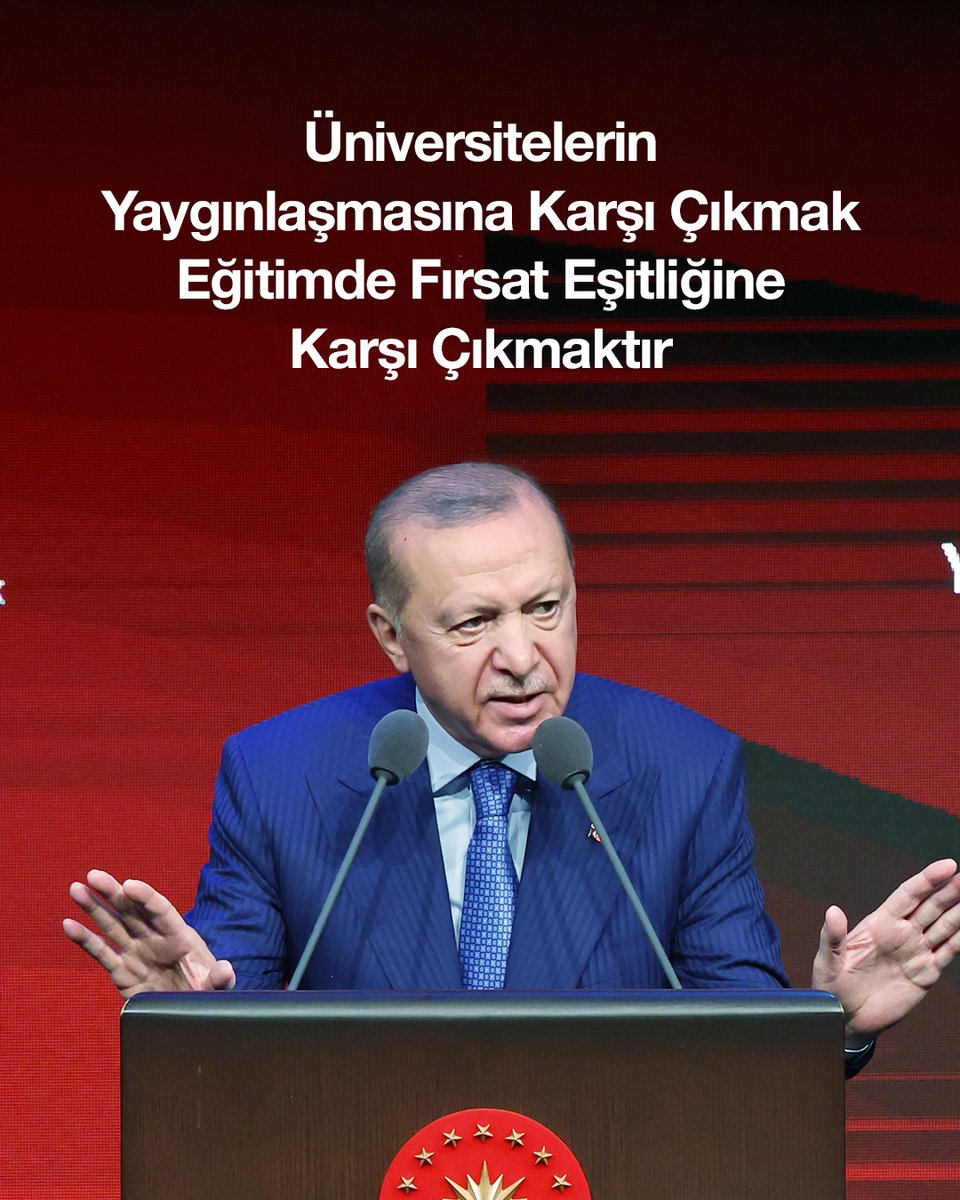 Turkish President Erdoğan gestures while speaking at a podium bearing Turkey's emblem, with a Turkish quote above him stating "Üniversitelerin Yaygınlaşmasına Karşı Çıkmak Eğitimde Fırsat Eşitliğine Karşı Çıkmaktır."