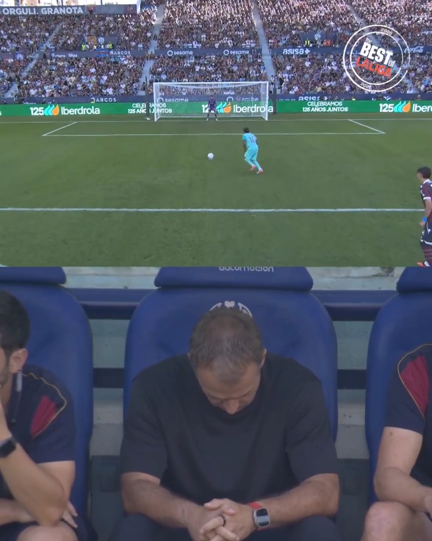 Hansi Flick is captured with his head bowed and hands clasped in tense anticipation as a Barcelona player prepares to take a penalty kick. The stadium advertising boards display "Iberdrola" and "125 ANIVERSARIO" alongside the "Best Skills" logo, framing this dramatic La Liga moment.