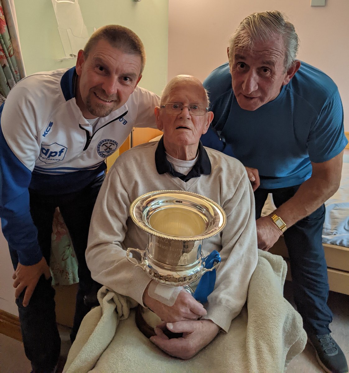 CarlowTownHC's tweet photo. A lovely gesture from a club contingent who paid a visit with the intermediate championship trophy to our long term clubhouse steward Michael Mc Gree. https://t.co/L3kq8XCSkf