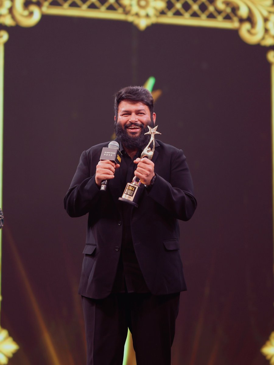 siima's tweet photo. Caught in a moment of pure joy as @MusicThaman celebrates another memorable milestone. ✨🏆

A smile that says it all.

#NEXASIIMA2026 #SIIMA2026 #Thaman #CandidMoments #SouthCinema https://t.co/owIC8eVsEw