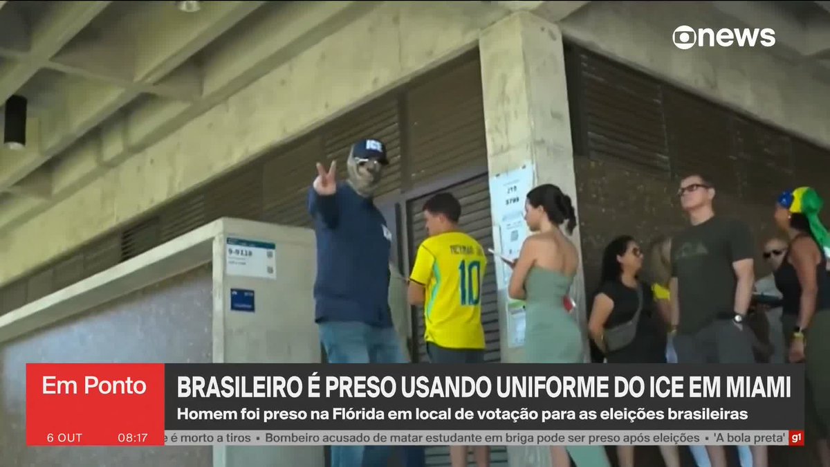 A screenshot of the news broadcast "Em Ponto" shows a man wearing an ICE cap and mask gesturing with a peace sign, alongside people in Brazilian-themed attire, with the headline reading "BRASILEIRO É PRESO USANDO UNIFORME DO ICE EM MIAMI." The chyron indicates he was arrested at a polling location for Brazilian elections in Florida, illustrating the news story's subject.