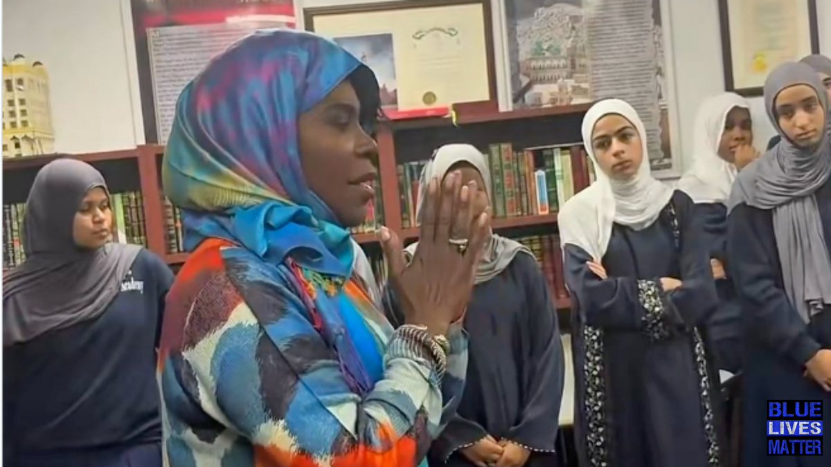 bluelivesmtr's tweet photo. CONQUERED: A clip released on October 5, 2026 shows Philadelphia Mayor Cherelle putting on a hijab inside Al-Aqsa Islamic Academy. She stands with girls dressed in navy abayas and matching covers.
⠀
Parker is a Democrat and the city's 100th mayor. She is the first woman to hold the office, and her term began January 1, 2024.
⠀
Ballotpedia lists her religion as Christian: Baptist. Yeah - right.

On camera she matched the covering worn by the female students around her.
⠀
The academy's uniform page requires girls to wear a plain navy blue abaya and a plain white or gray hijab. Boys are listed in gray pants and a navy polo with the Al Aqsa logo.
⠀
The school opened in 1996 at 1501 Germantown Ave in Philadelphia. It is a coeducational kindergarten through 12th grade program affiliated with the Al-Aqsa Islamic Society.
⠀
Its mission statement says students should become citizens "based on the teachings of Islam and the Sunnah."
⠀
Coursework includes Islamic studies and Quran classes alongside a standard curriculum. Wall posters in the room asked what Muslims think of Jesus.
⠀
In her January 2, 2024 inaugural address she said, "Today, I swear an oath as Philadelphia's 100th Mayor and the first woman to hold the office in 341 years."
⠀
She told reporters she wants girls to say, "Wow, no one can put me in a box." That line came from a May 2023 news conference on her path to the nomination.
⠀
In March 2025 Governor Josh Shapiro announced a $5 million Redevelopment Assistance Capital Program grant at an iftar at the Al-Aqsa Islamic Society. His office called it the largest grant the commonwealth has given a Muslim organization.
⠀
Board chairman Asif Hussain said the K-12 school has about 300 students and more candidates than classrooms. He described a plan to expand attendance from 300 toward 3,000.
⠀
Shapiro told the room, "So I'm really proud that we've been able to work together with your leaders here to invest $5 million in making this place an even greater center of activity in the community."
⠀
#Philadelphia #hijab