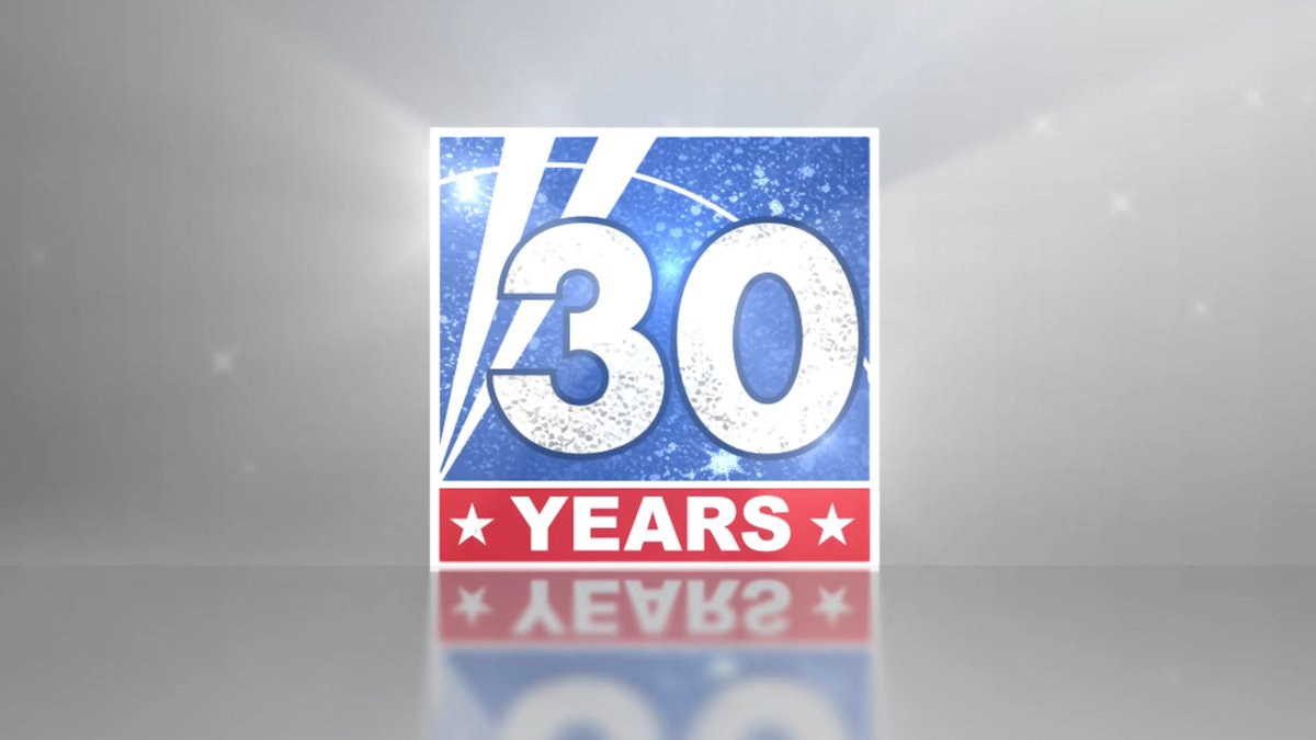 A 3D-rendered graphic features the number '30' in large white text on a blue, sparkling background with a red banner below reading 'YEARS', suggesting a 30th-anniversary celebration.