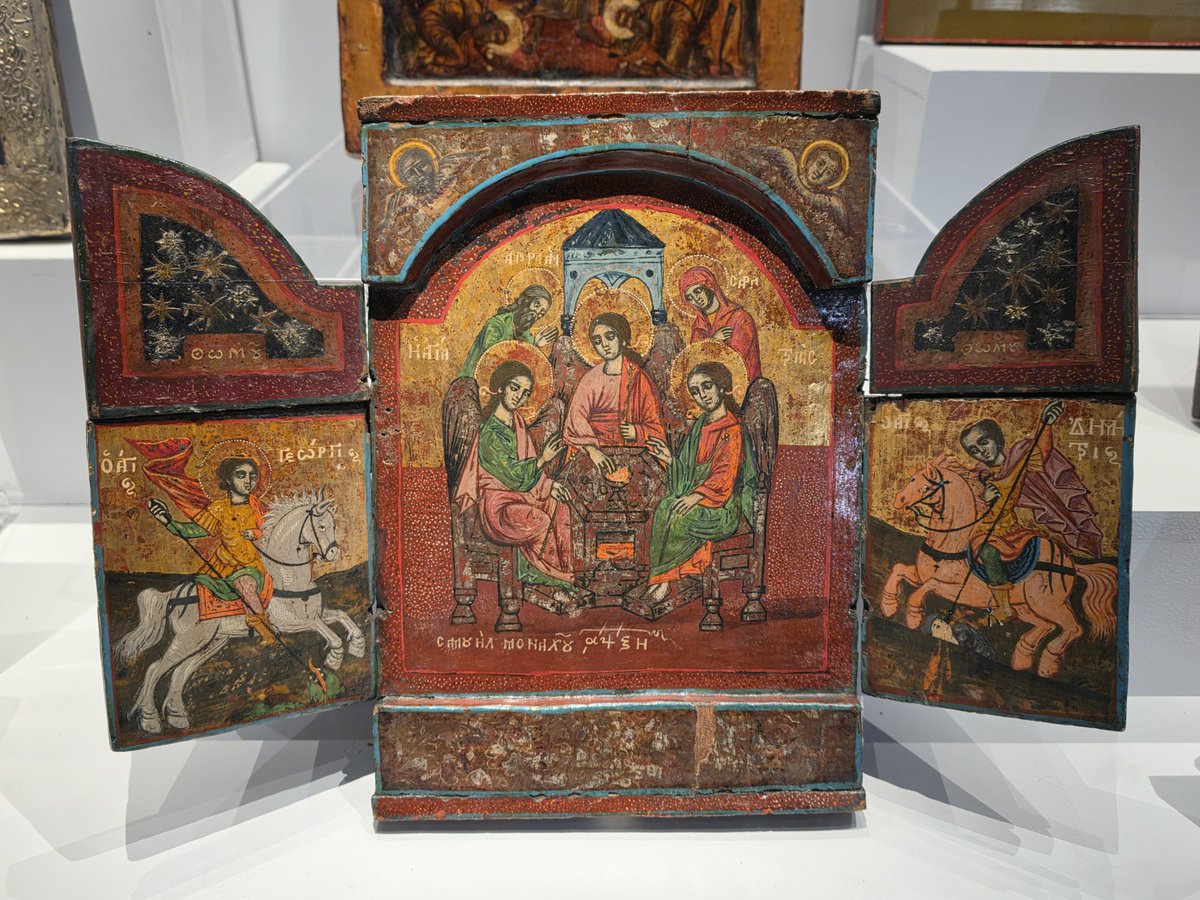TheSimonKnott's tweet photo. Blackburn Museum has a remarkably good, and large, collection of Greek and Russian icons. This triptych depicts Abraham and Sarah with the three angels, flanked by St George and St Dmitri. Greek, 1768. https://t.co/l2r1YoTKh6