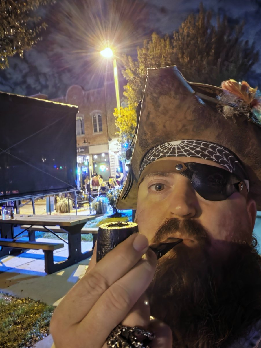 TreasureCPirate's tweet photo. Sittin' behind tha stage enjoyin' tha live music an' a pipe at Pirate Fest 2026! https://t.co/JdzbJZkYuS