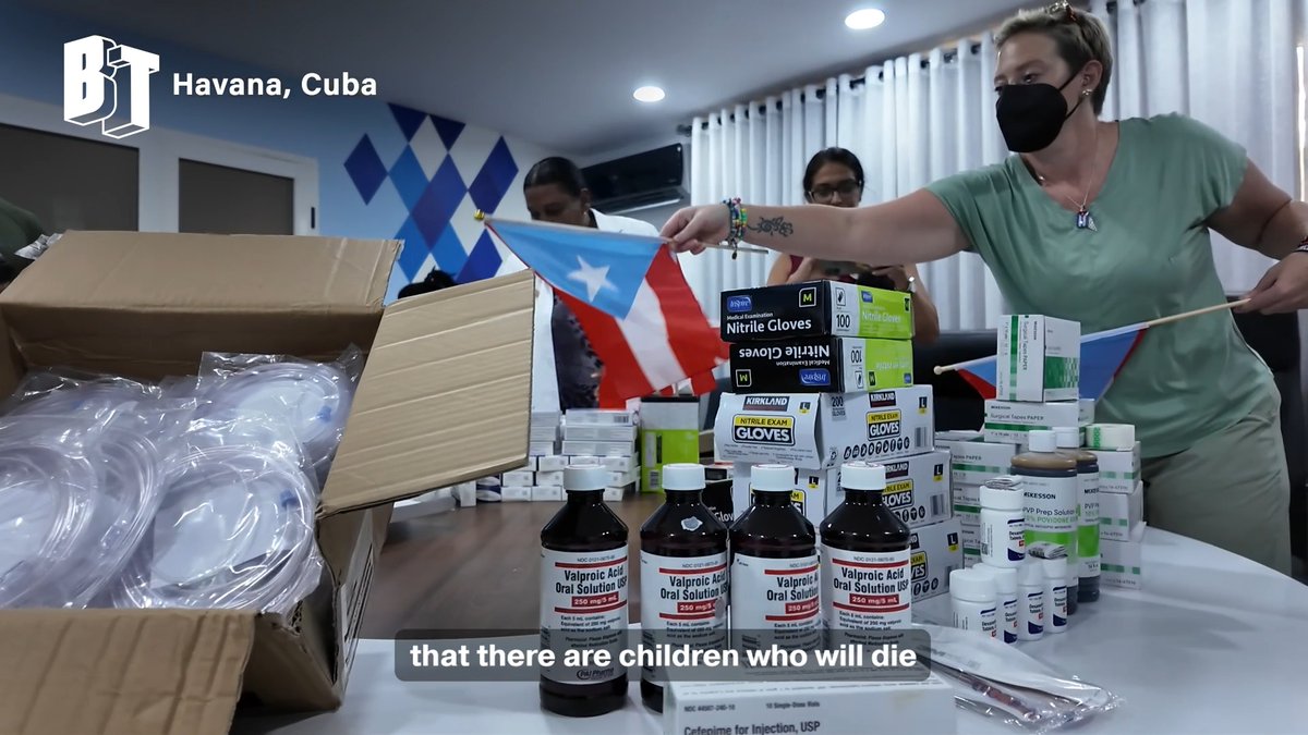 A news clip from BT shows people in Havana, Cuba organizing medical supplies including Kirkland nitrile gloves, Cefepime, and Valproic Acid, with a woman holding a Puerto Rican flag and subtitles reading 'that there are children who will die'.