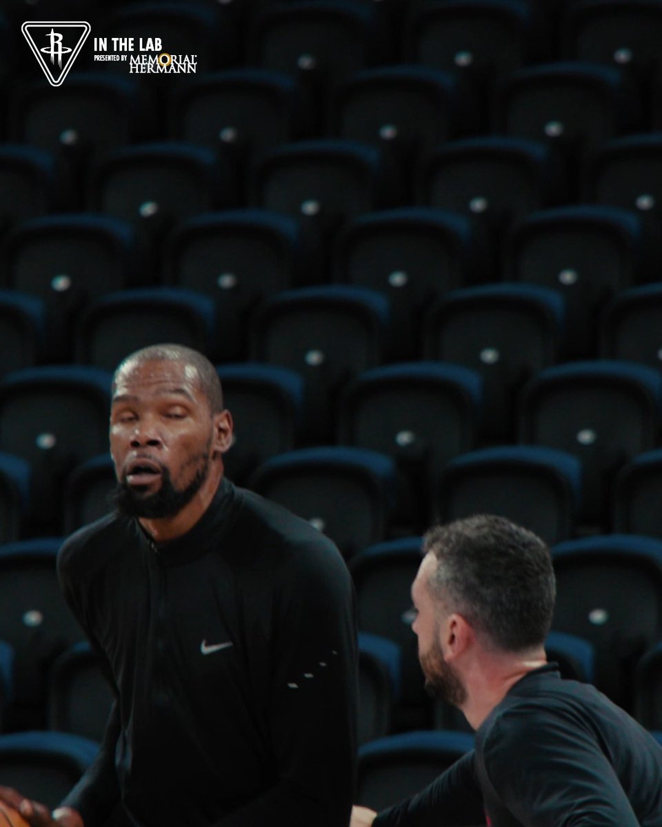Two Houston Rockets players, including Kevin Durant, are seen in conversation during preseason drills in an empty arena, as indicated by the "IN THE LAB" branding and Memorial Hermann logo in the top corner, tying into the post's mention of preseason reps at the team's medical partner.