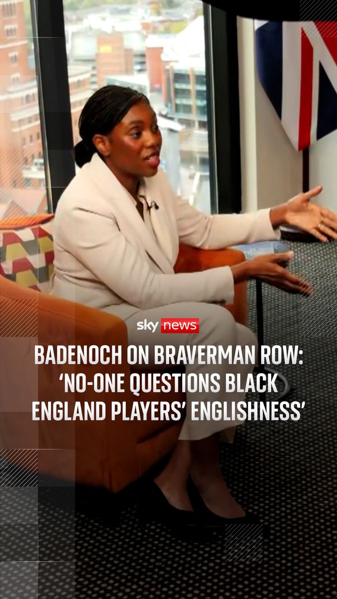 Sky News shows Conservative leader Kemi Badenoch seated in an orange armchair gesturing while speaking, with the on-screen headline reading "BADENOCH ON BRAVERMAN ROW: 'NO-ONE QUESTIONS BLACK ENGLAND PLAYERS' ENGLISHNESS'" alongside a Union Jack flag, directly illustrating her Sky News interview with Beth Rigly responding to Suella Braverman's controversial comments about her own English identity.