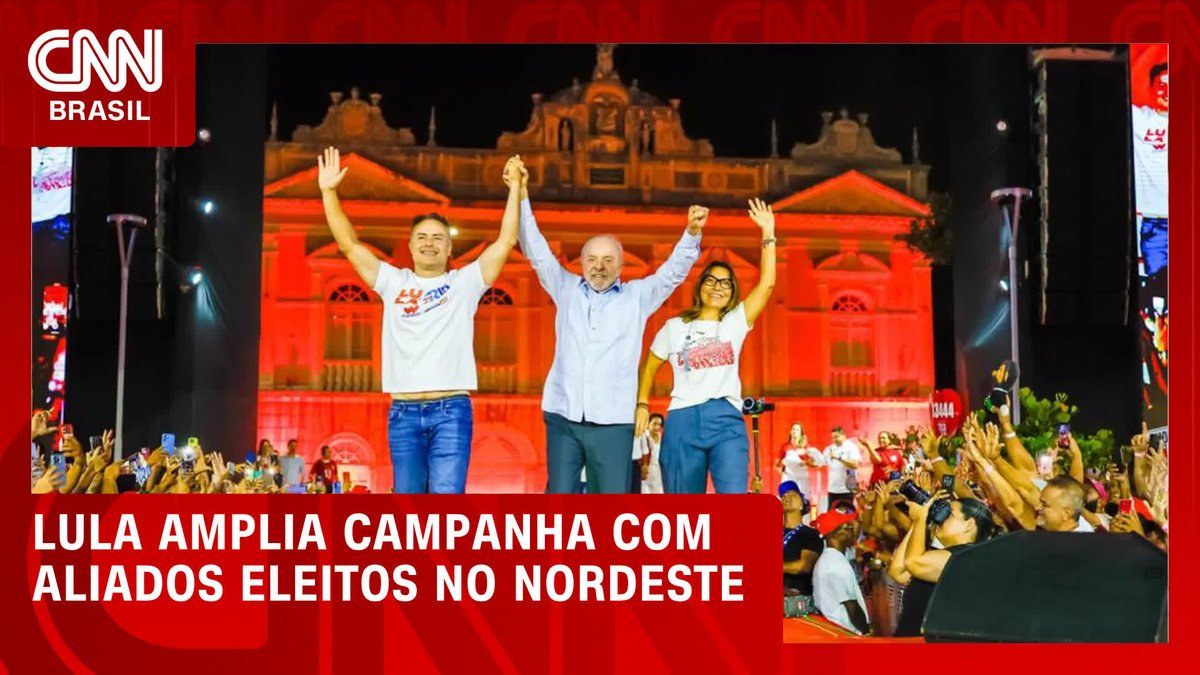Three politicians raise their joined hands in triumph on stage at a nighttime campaign rally, with a historic building illuminated in red behind them. The CNN Brasil banner reads "LULA AMPLIA CAMPANHA COM ALIADOS ELEITOS NO NORDESTE," matching the post's message about Lula expanding his campaign with elected allies in the Northeast.