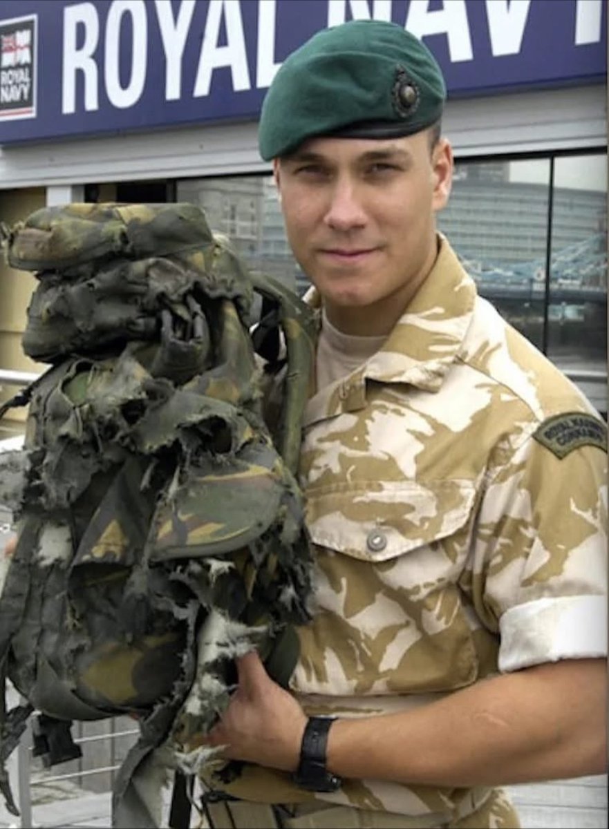 specialopsmag's tweet photo. On the night of 9 February 2008, near Sangin in Helmand Province, Royal Marine Lance Corporal Matthew Croucher was moving with a small recon team through a compound suspected of being used by the Taliban. 

He felt a tripwire against his leg and realised he had triggered a grenade. With his comrades exposed and only seconds left, he threw himself onto it, pinning the grenade between his day sack and the ground and tucking his legs in. 

The blast destroyed the pack, set a battery inside it on fire, and pitted his body armour and helmet, but he walked away with only minor injuries. His three teammates were largely unhurt. 

Croucher refused immediate evacuation. The patrol stayed, ambushed the fighters who came to investigate the explosion, and he himself killed one of them. 

He was awarded the George Cross, the highest British award for gallantry not in the face of the enemy, and received it from Queen Elizabeth II at Buckingham Palace on 30 October 2008. 

He remains one of a very small number of living recipients.