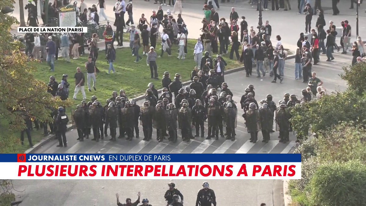 A news broadcast screenshot from CNews showing police in riot gear at Place de la Nation in Paris, with the headline 'PLUSIEURS INTERPELLATIONS À PARIS'.