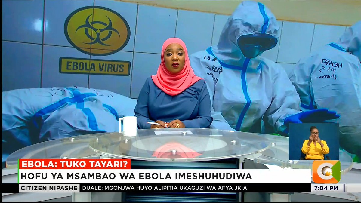 A news anchor in a pink hijab presents on Citizen TV's "Citizen Nipashe" at 7:04 PM, with a backdrop showing healthcare workers in hazmat suits and an "EBOLA VIRUS" biohazard symbol. The chyron reads "EBOLA: TUKO TAYARI?" and "HOFU YA MSAMBAO WA EBOLA IMESHUHUDIWA," covering concerns about Ebola outbreak preparedness in Kenya following cases near the Uganda border, with a sign language interpreter visible in the bottom corner.