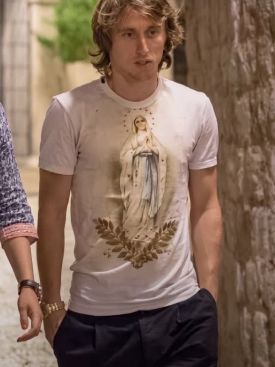 HardestFitPics's tweet photo. Luka Modrić wearing Dolce &amp; Gabbana Virgin Mary Religious Ivory T-Shirt https://t.co/veniVS2Het