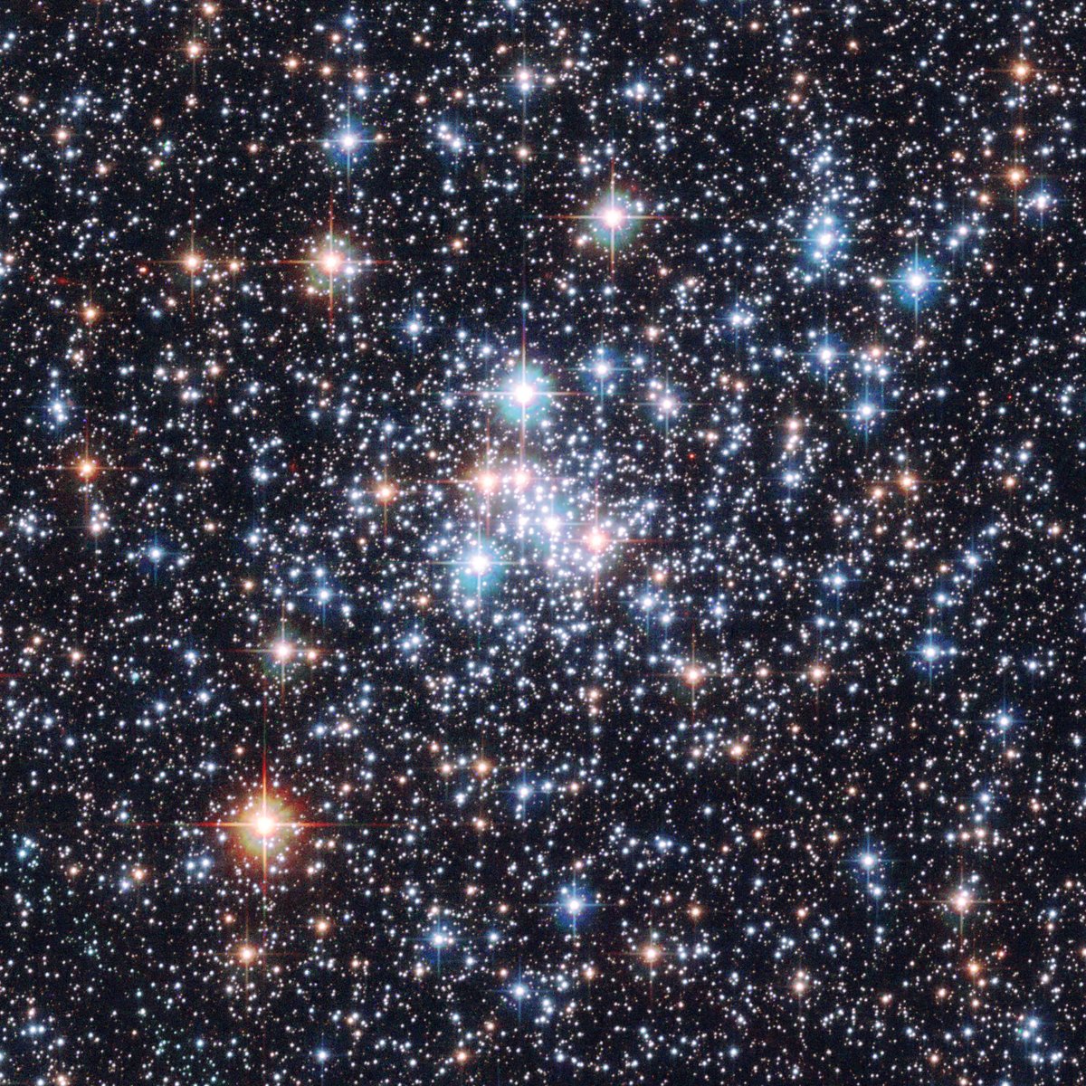 NASAHubble's tweet photo. About 200,000 light-years away, the star cluster NGC 290 glitters within the Small Magellanic Cloud – a small galaxy orbiting our Milky Way.

NGC 290 stretches 65 light-years across. The stars in this cluster are loosely bound to one another by gravity: https://t.co/0bD3z6pebU https://t.co/2Rh7IoVytj