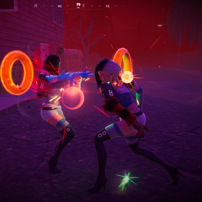 A screenshot from a video game showing two characters with glowing orange rings engaged in combat in a red-lit environment, with a compass overlay at the top displaying '70 E'.