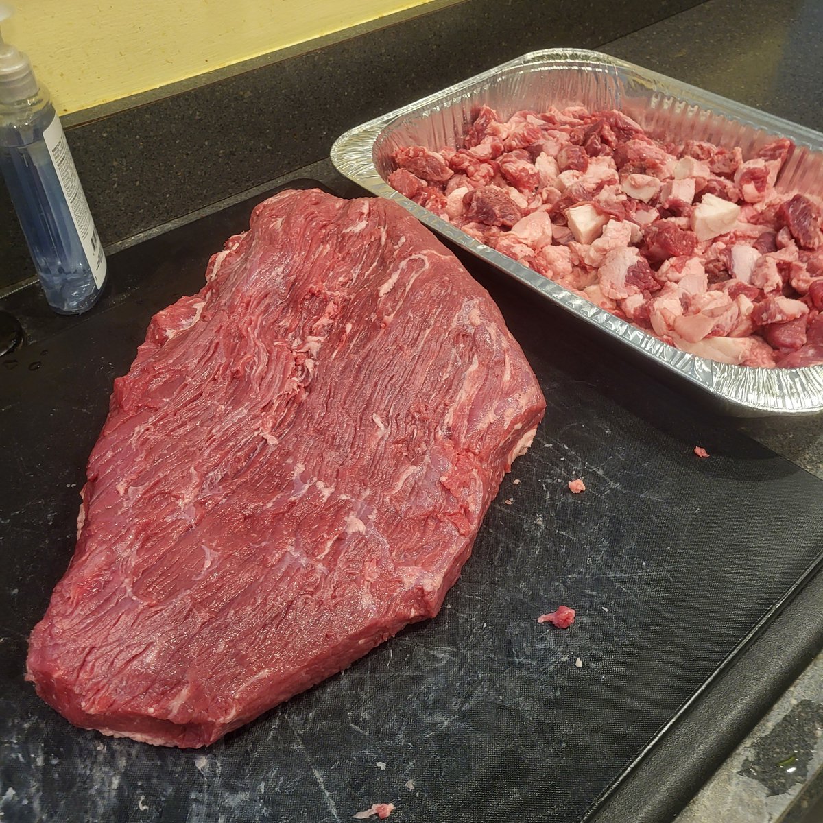 TimVieth's tweet photo. Used lunch to trim brisket, attempting tallow with the cuts. Wet brine for about 36 hours then smoke https://t.co/UgfSj57c4Z