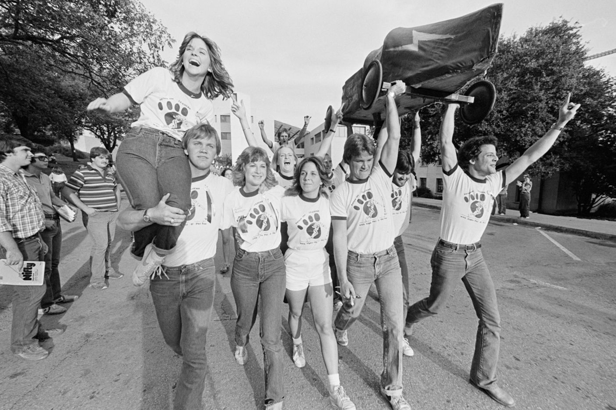 txstatealumni's tweet photo. The Soap Box Derby is a beloved tradition held since 1967 and is an annual favorite during Homecoming. Student organizations build homemade cars and race them against each other. Pictured here are a group of students celebrating their Soap Box Derby win sometime in the 1980s. https://t.co/LeywWRVhEI