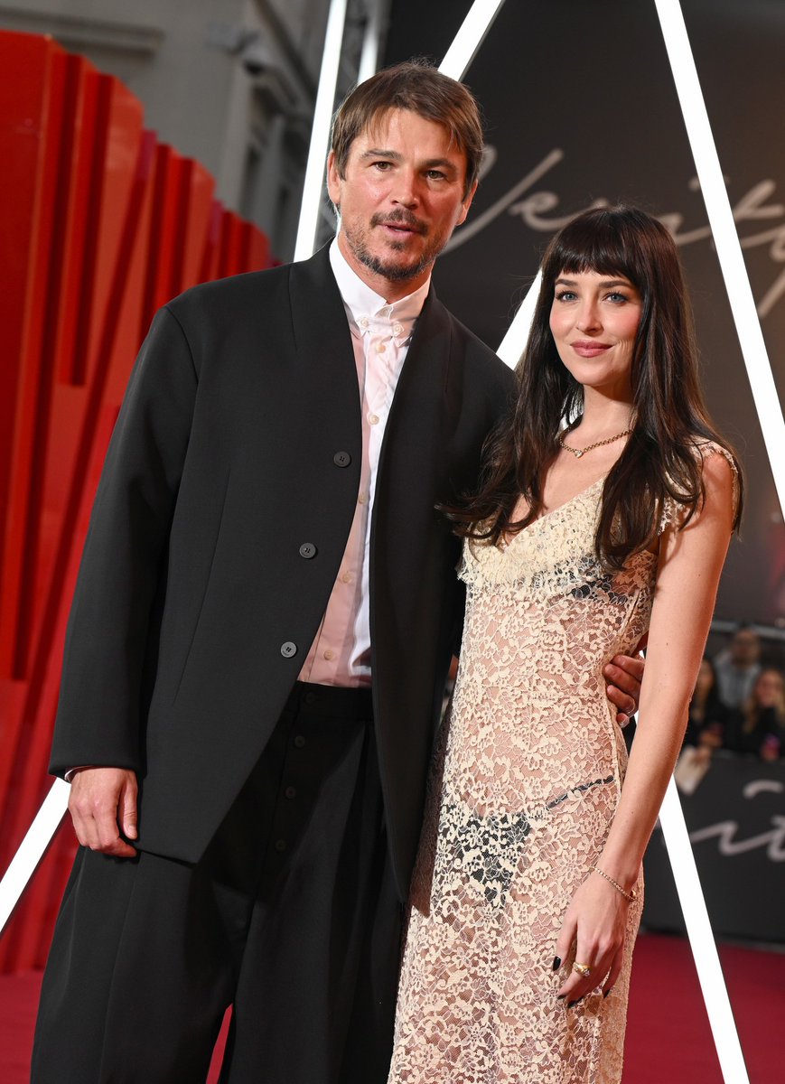 JustJared's tweet photo. Dakota Johnson &amp; Josh Hartnett are in London for the UK premiere of their new movie #Verity

Photos: Getty https://t.co/6bUahg4XQQ