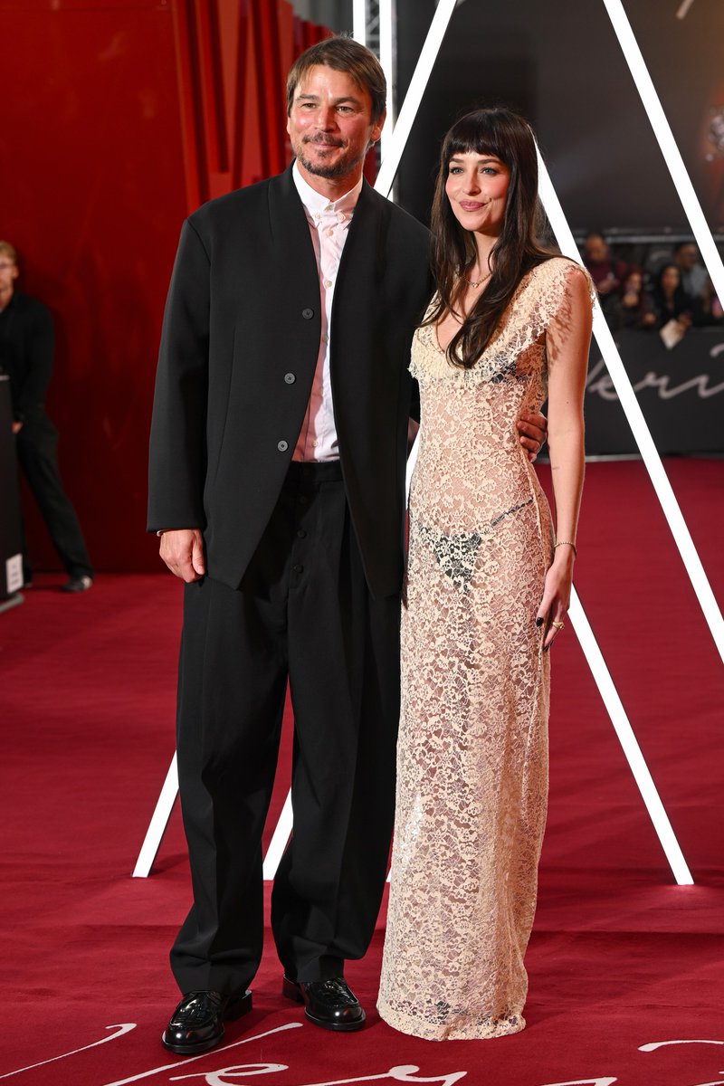JustJared's tweet photo. Dakota Johnson &amp; Josh Hartnett are in London for the UK premiere of their new movie #Verity

Photos: Getty https://t.co/6bUahg4XQQ