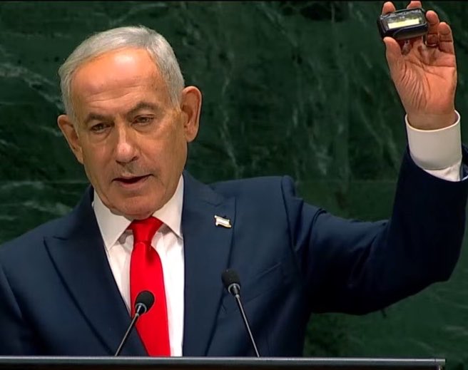 JimmyJ4thewin's tweet photo. 🚨NEW: PM Netanyahu held up a pager from the UN podium, bragging about targeting Lebanon. https://t.co/BN87yUKp7U