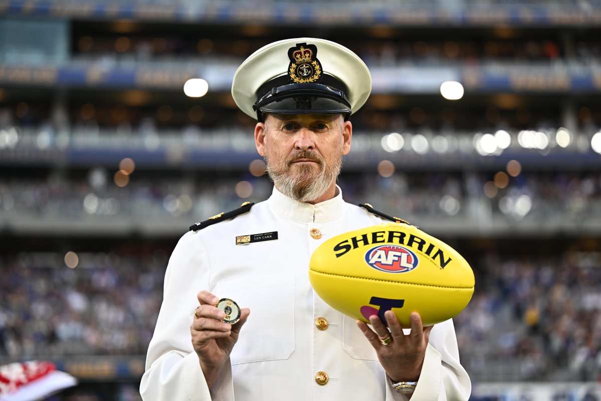 DefenceAust's tweet photo. Different uniform. Same game face. 🏉

Ahead of the @AFL Grand Final this weekend, we’re looking back at Warrant Officer Len Carr on coin-toss duties at the HMAS Sydney II Memorial Game in Perth in 2022.

Who are you picking this weekend? 🏆

#YourADF #AFLGF @Australian_Navy https://t.co/69HttLroFK