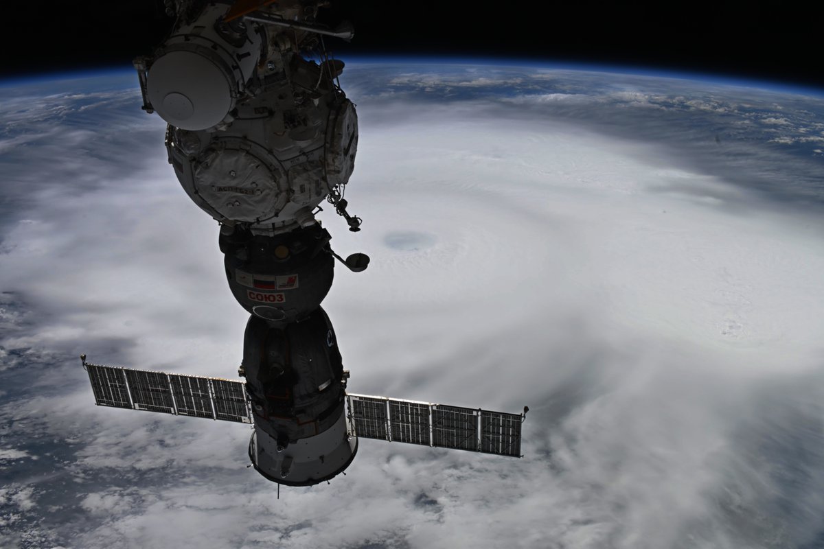 Astro_Jessica's tweet photo. Hurricane Polo is looking massive from the @Space_Station cupola (close-up of the eye in photo 2).  Just happened upon this today so will have to plan for more photos on the next pass with an opportunity.  Stay safe Mexico!  Hoping the Pacific calms down a bit for our splashdown . . .