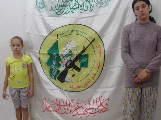 VerminusM's tweet photo. It's amazing. Palestinians can make a video of two little girls kidnapped b Hamas, forced to say to the camera they were kidnapped by Hamas, while standing in front of a Hamas emblam, and still people will deny it happened. https://t.co/wU91Nbqc01