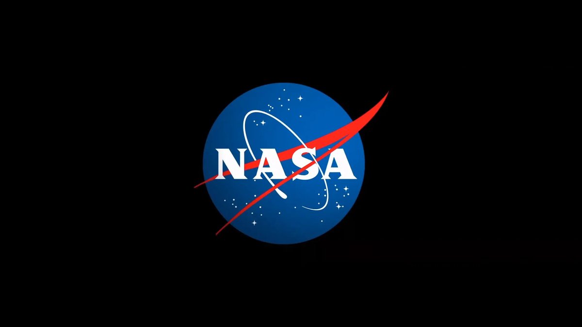 The NASA “meatball” logo, showing a blue circle with white stars and a white orbital path, crossed by a red aerodynamic swoosh. The word “NASA” appears in bold white letters at the center. The logo sits against a solid black background.