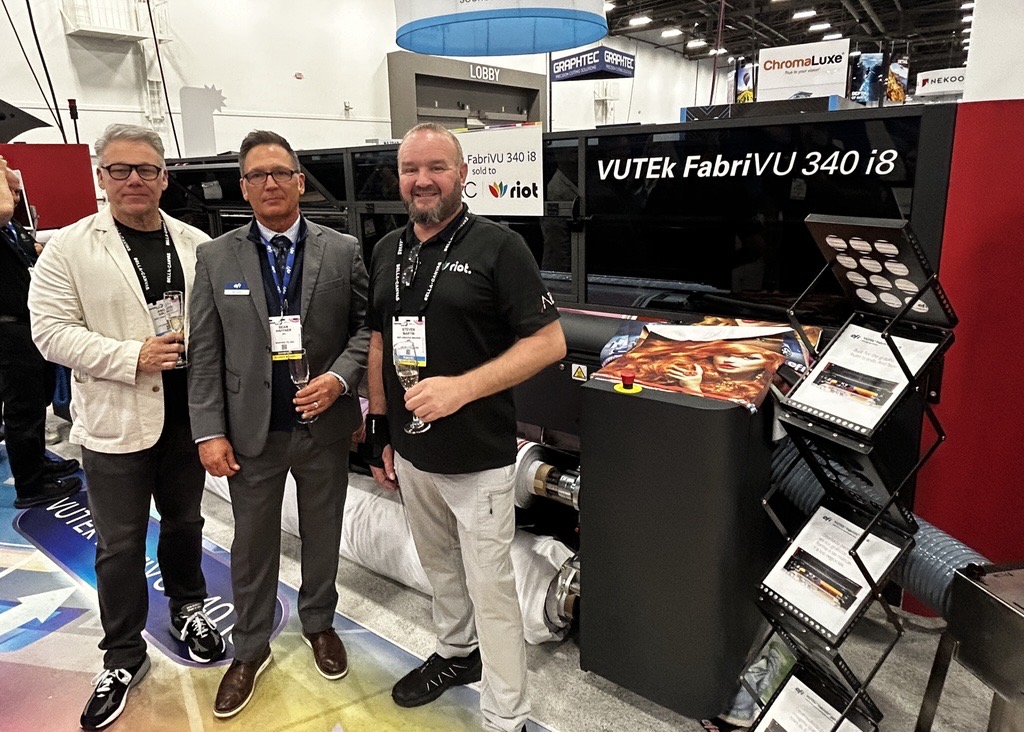 EFIPrint's tweet photo. Congratulations to ARC | RIOT Las Vegas on their purchase of the #EFIFabriVU 340 i8 dye-sublimation printer. It was great to welcome Steve Martin, General Manager, and Andrew Giraldo, Vice President, to the EFI booth to celebrate this investment and their continued growth! https://t.co/OgSPhbOHjn