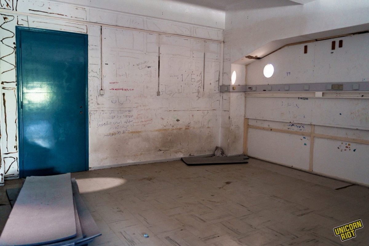 UR_Ninja's tweet photo. The main temporary holding site in Heraklion remains the former psygeio — a Coast Guard cold-storage building in the port area. Meant to hold just 70 to 80 people, the site held more than 450 in the first months of 2026, forcing men, women and children to sleep on the floor. https://t.co/YUNp8jQKjA