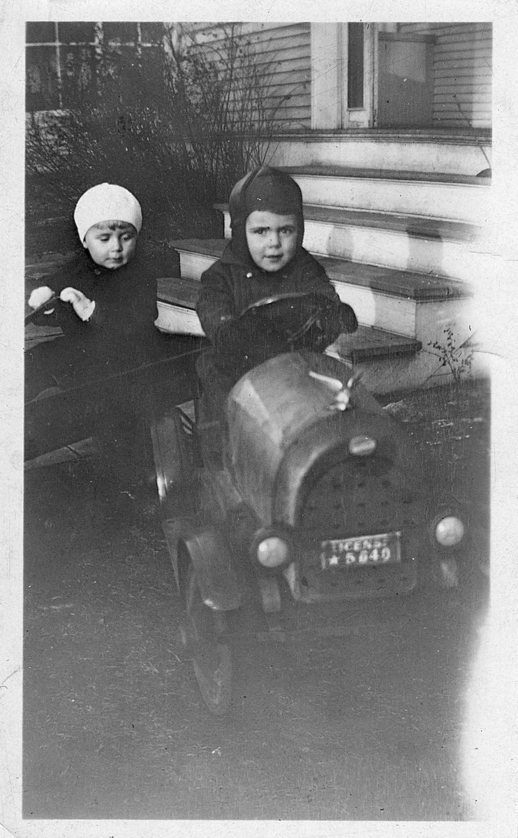 texdub's tweet photo. Hey, @iowahawkblog, not sure if davescaridservice is up to a pedal car challenge from this 1931 photo in Minneapolis. My Uncle Roger at the wheel of a car, while his little brother Ralph (future author and Notre Dame philosophy professor) looks on from his Red Racer wagon. https://t.co/ONe1W4j6wc