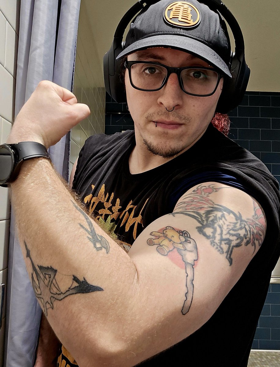 PossumGamer's tweet photo. tempted to send this to my tattoo artist so she can see how my RE4 tattoos look after healing https://t.co/ScNKoN9s4n