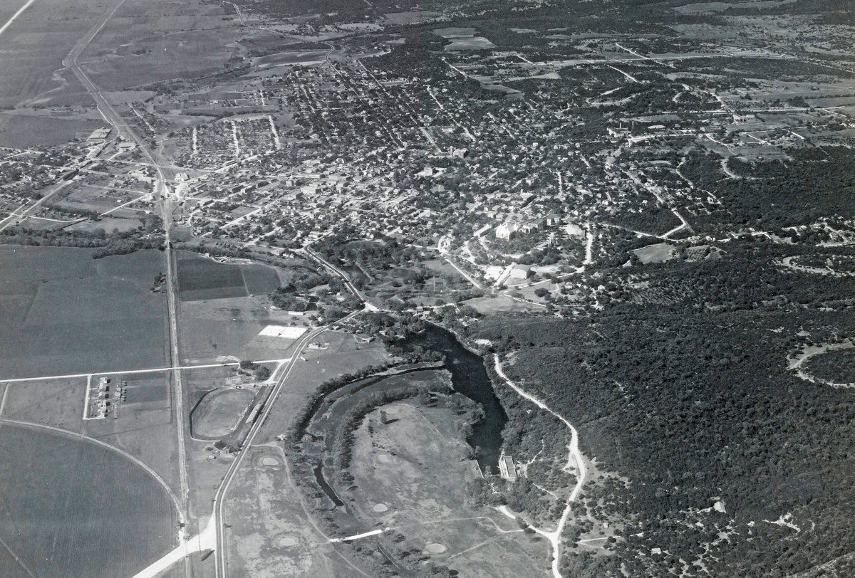 TracesofTexas's tweet photo. Beautiful San Marcos, Texas as seen from the air in 1936.  The town had a population of 5500 or so then; it's currently more than 75,000.  This is a huge, high resolution photo, which means you should be able to enlarge it mightily and see the details. Clearly visible are Texas State University, the San Marcos River etc ....

Super duper!