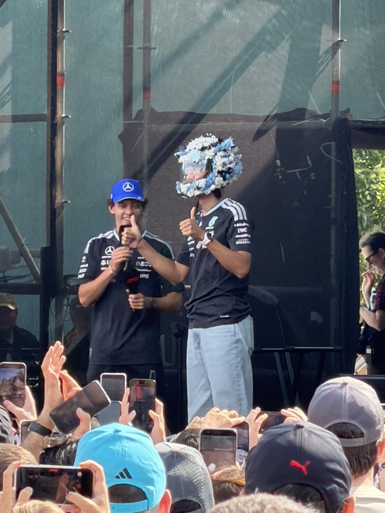 44ology's tweet photo. he put on a flower helmet made by a fan george is so kind 😭❤️ https://t.co/kAljscJieC